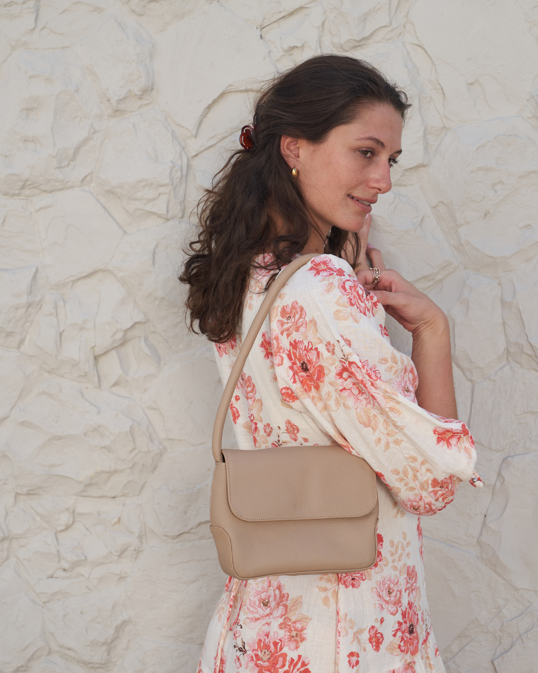 Model holding Stone Bare Leather Patsy Bag.