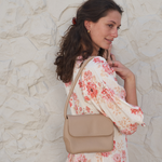 Model holding Stone Bare Leather Patsy Bag.