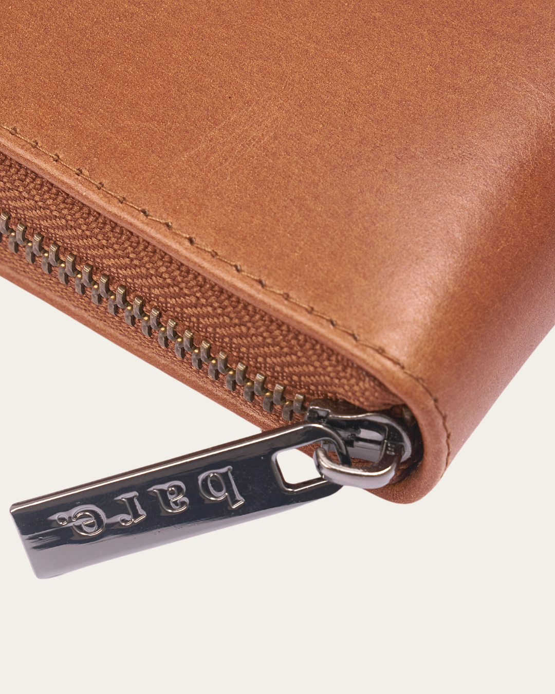 Camel Bare Leather Quinn wallet showing the zip and hardware detail.