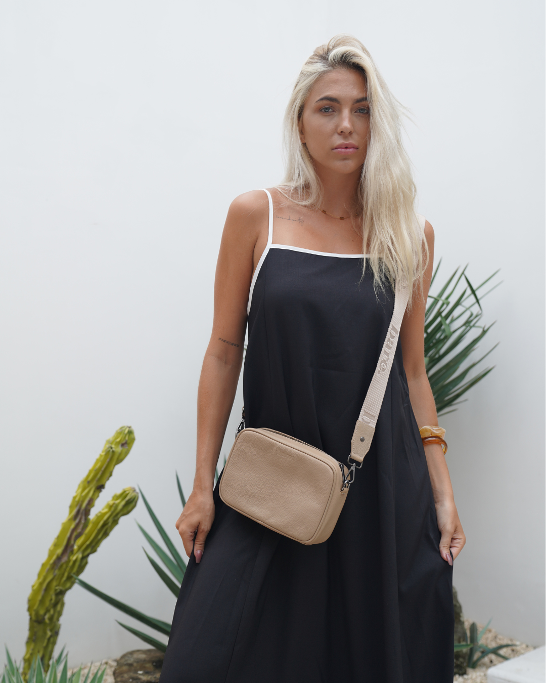 Stone Bare Leather Esme bag worn with crossbody strap