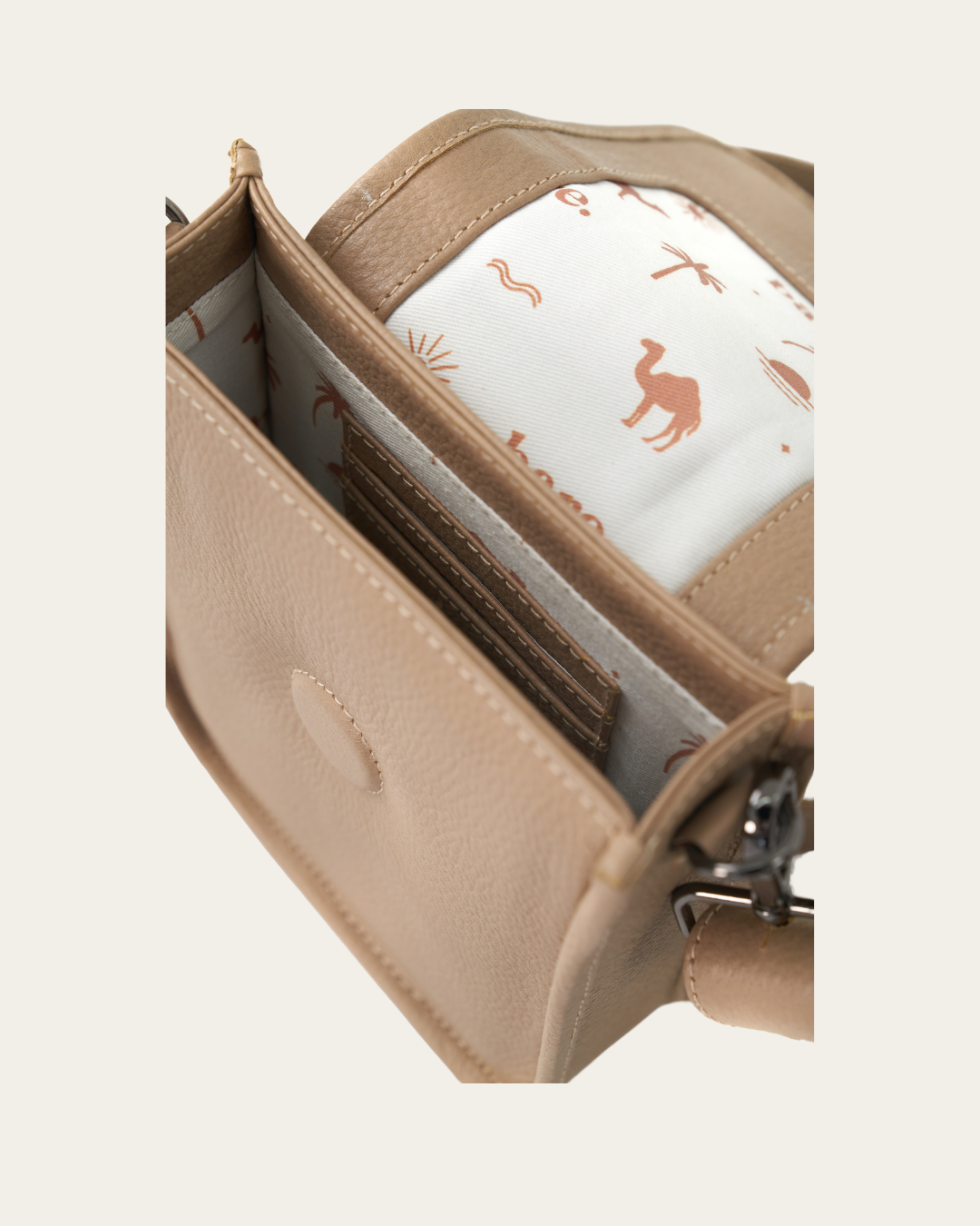 Stone Bare Leather Hadley Bag open to see the inside of the bag.
