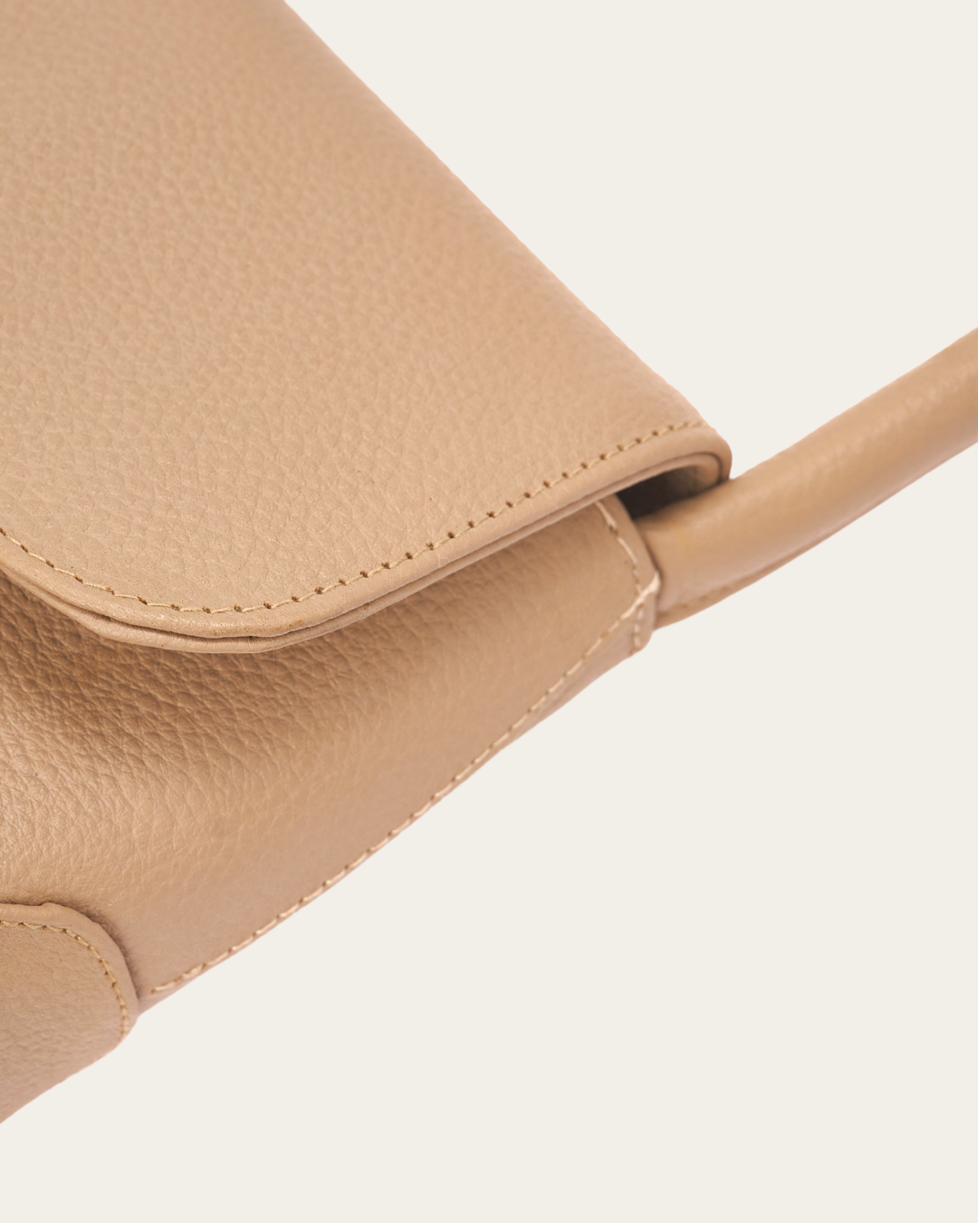 Image shows part of the front of the Bare Leather Patsy bag to show the detail in the stitching.