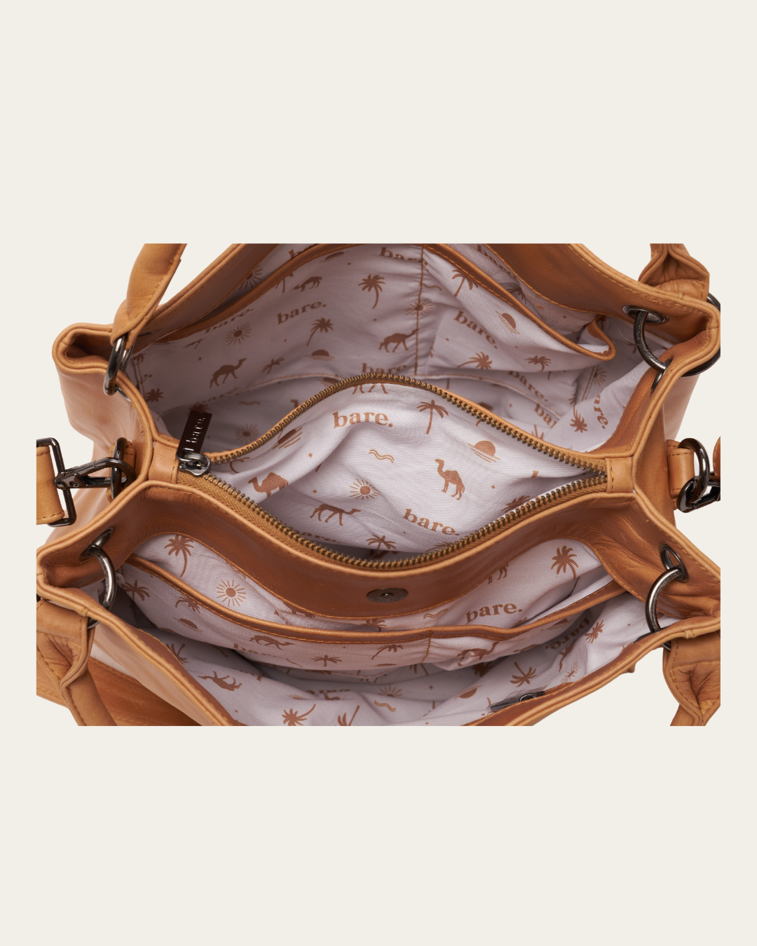 Image shows the inside features of the Almond Bare Leather Remy Bag.