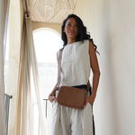 Camel Bare Leather Esme Bag worn with crossbody strap
