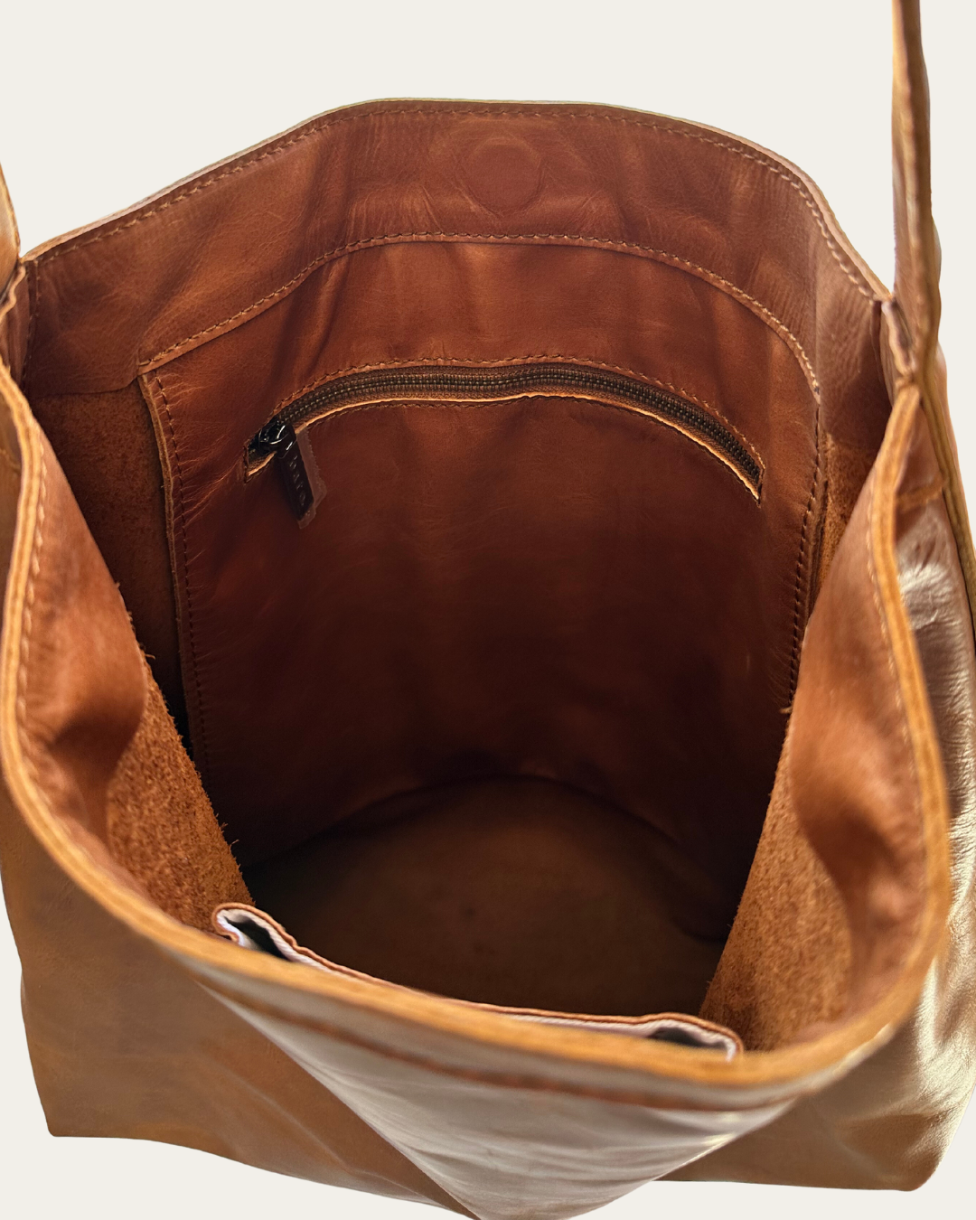 Camel Bare Leather Lulu bag, image shows the inside features of the bag