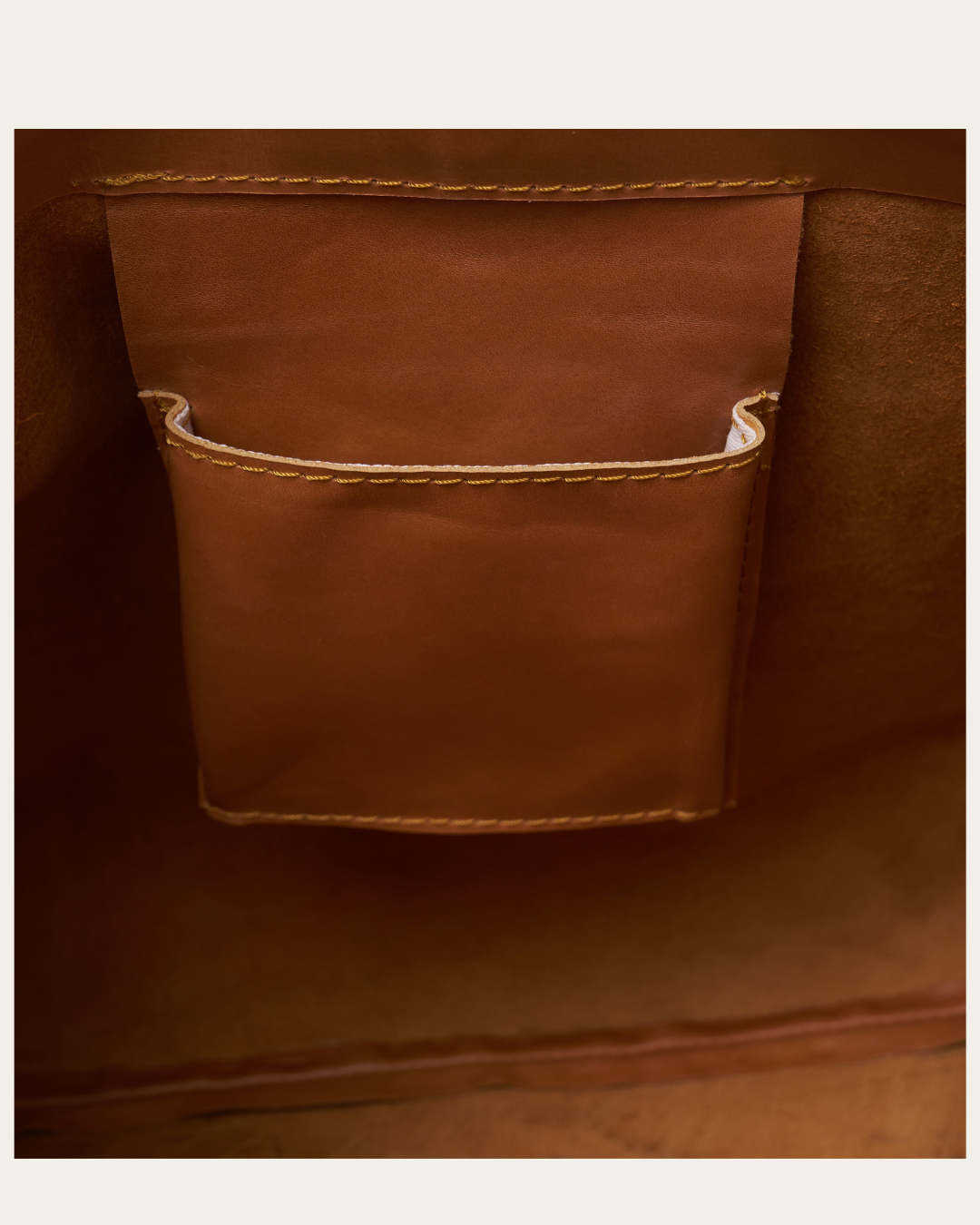 Image show the inside pocket of the Camel Bare Leather Lulu bag