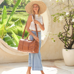 Camel Bare Leather Weekender Bag with model using the extension strap