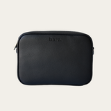 Esme Bag Black Bare leather with 'bare' branding on a beige background