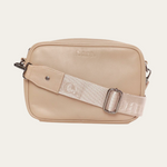 Stone Bare Leather crossbody bag with a nylon strap on a light beige background