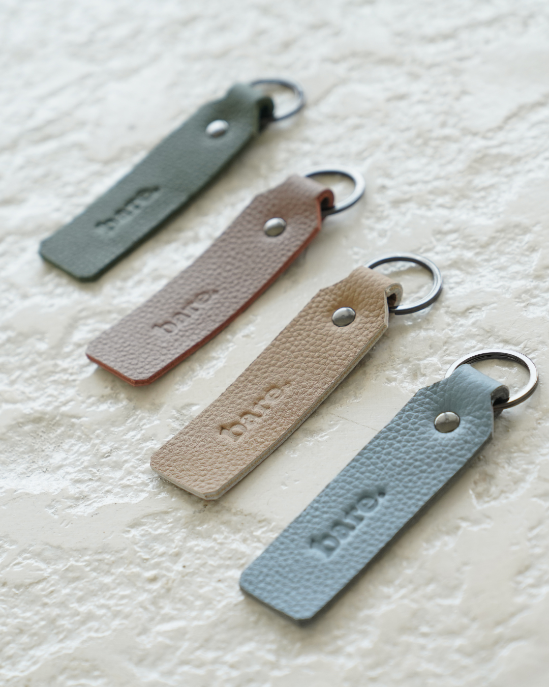 Bare Leather Key Ring in four colourways. Mocha, Olive, Stone and Powder Blue