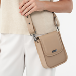 Model wearing Stone Bare Leather bag as a crossbody bag. Front